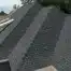 Large grey roof under inspection