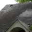 Aerial view of roof surface showing the top section of shingles, illustrating how roof damage affects your home’s value.
