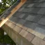 Eco-Friendly Roofing for Spring - WorleyByrd image of a residential roof with gray shingles in sunlight